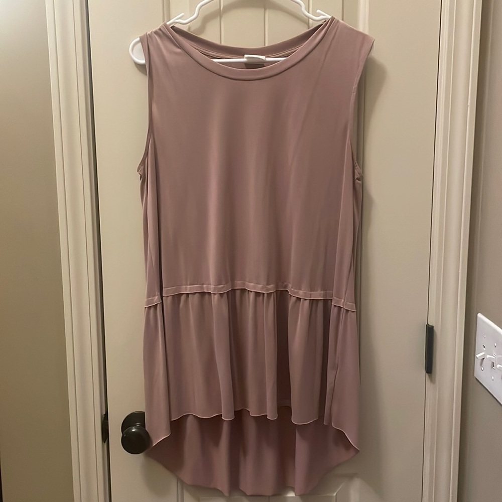 Light pink women’s droptail sleeveless blouse